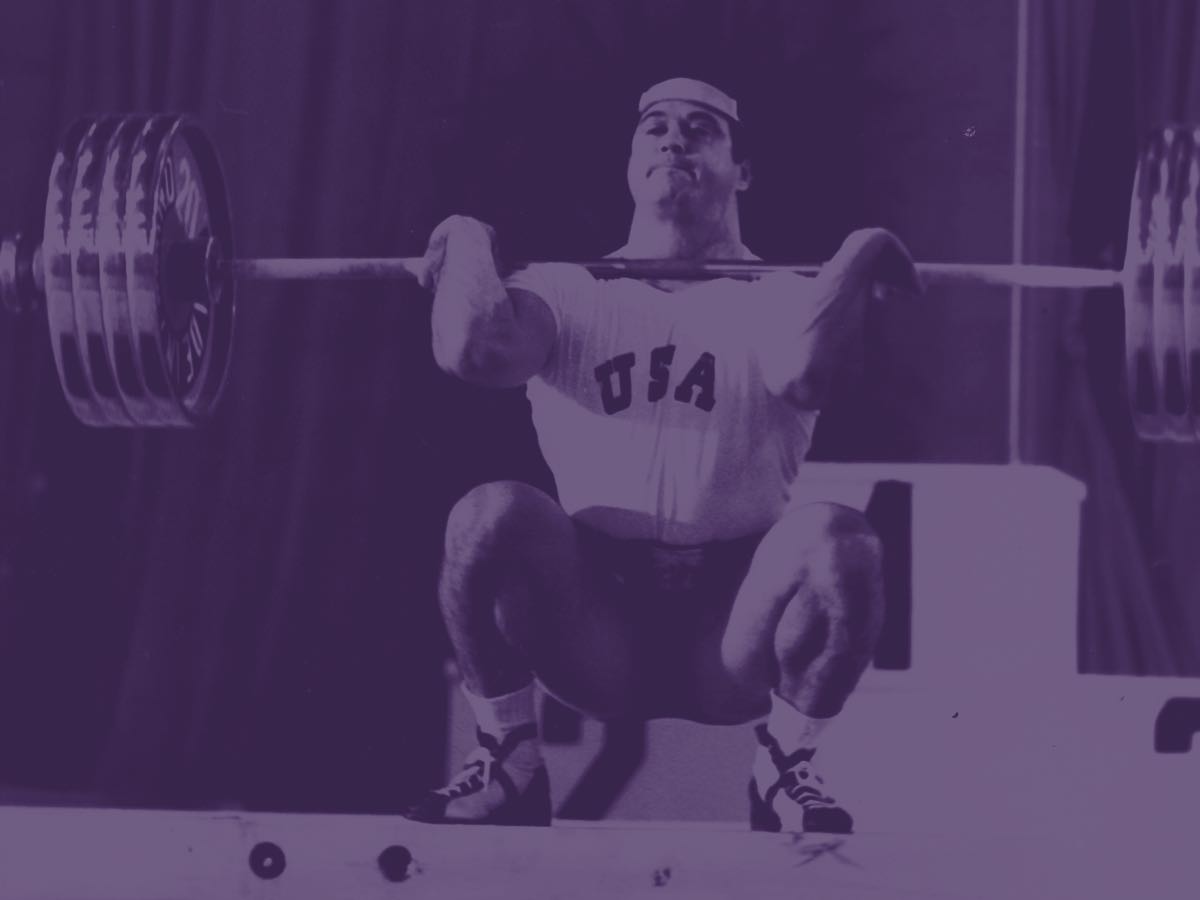 Olympic weightlifter performing a clean-and-jerk.